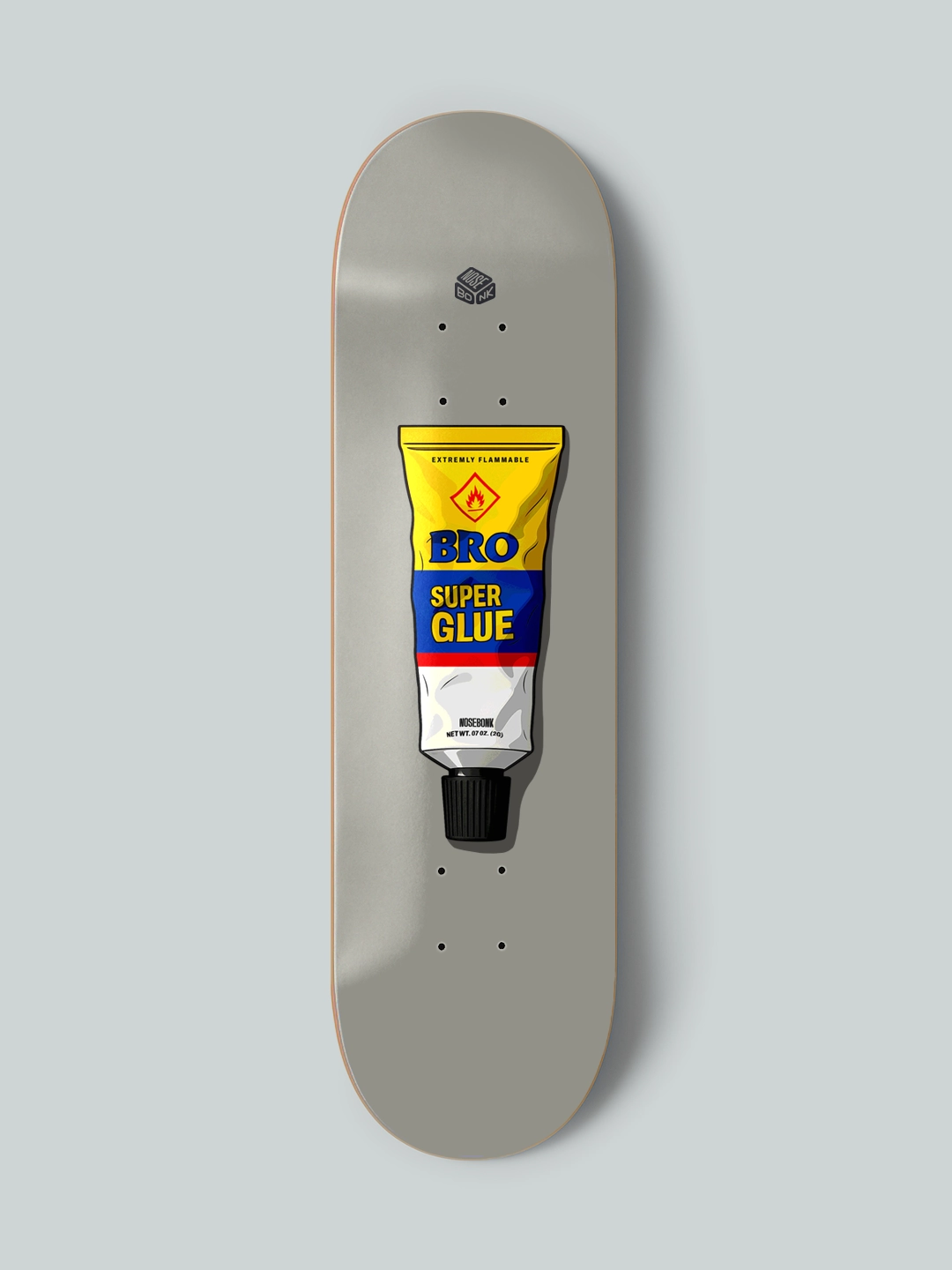 Skate deck design by Nosebonk – featuring a retro super glue tube labeled "BRO", centered on a grey board with realistic shadows and packaging details.