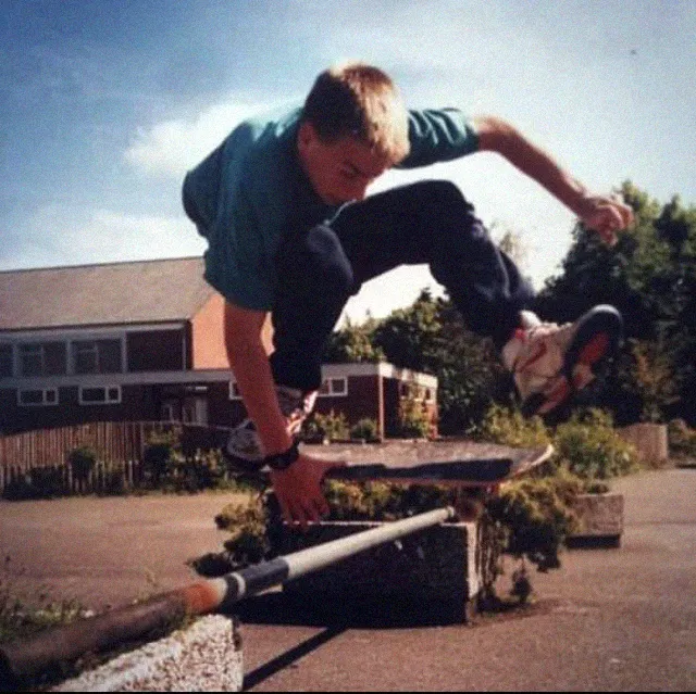 Erik Ziegler founder of the independent skate art project Nosebonk performing a Big ollie Indy grab onefoot over bar at NIGE internats gymnasium ESENS Niedersachsen, Mid 90s