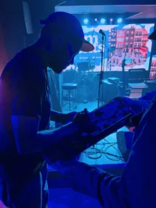 Ray Barbee signing skateboards for fans after his concert at El Sótano in Madrid — music and skate culture coming together.