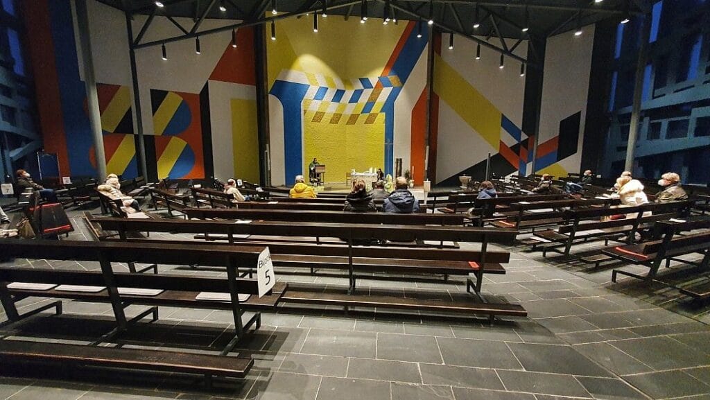 Kirche St. Joseph, Bünde. Architecture by Joachim Georg Hanke. Geometric mural by an unknown artist. Bauhaus vocabulary — the same visual language as Munich 1972.