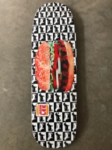 Jason Lee pro deck 1990s — consumer culture iconography including Burger King branding applied as skateboard graphic design